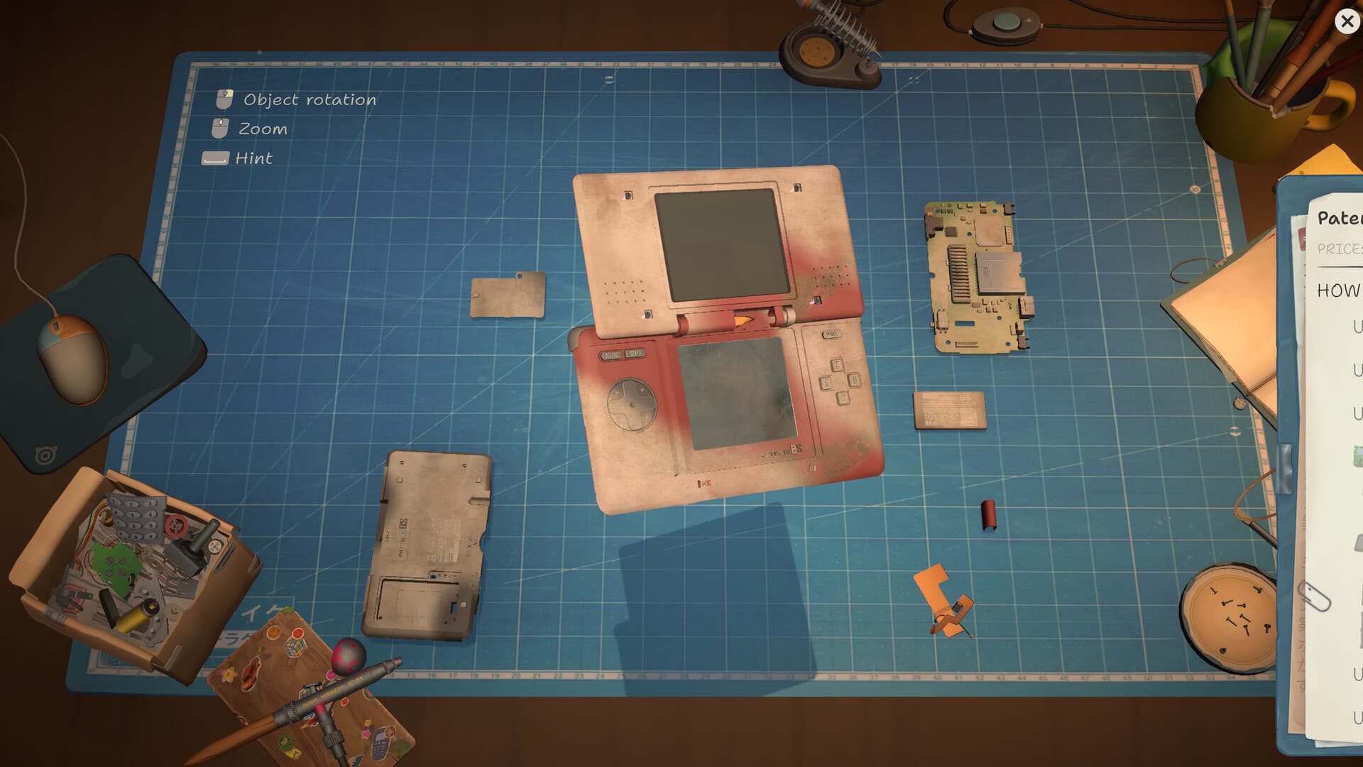 Handheld console disassembled on the ReStory workbench