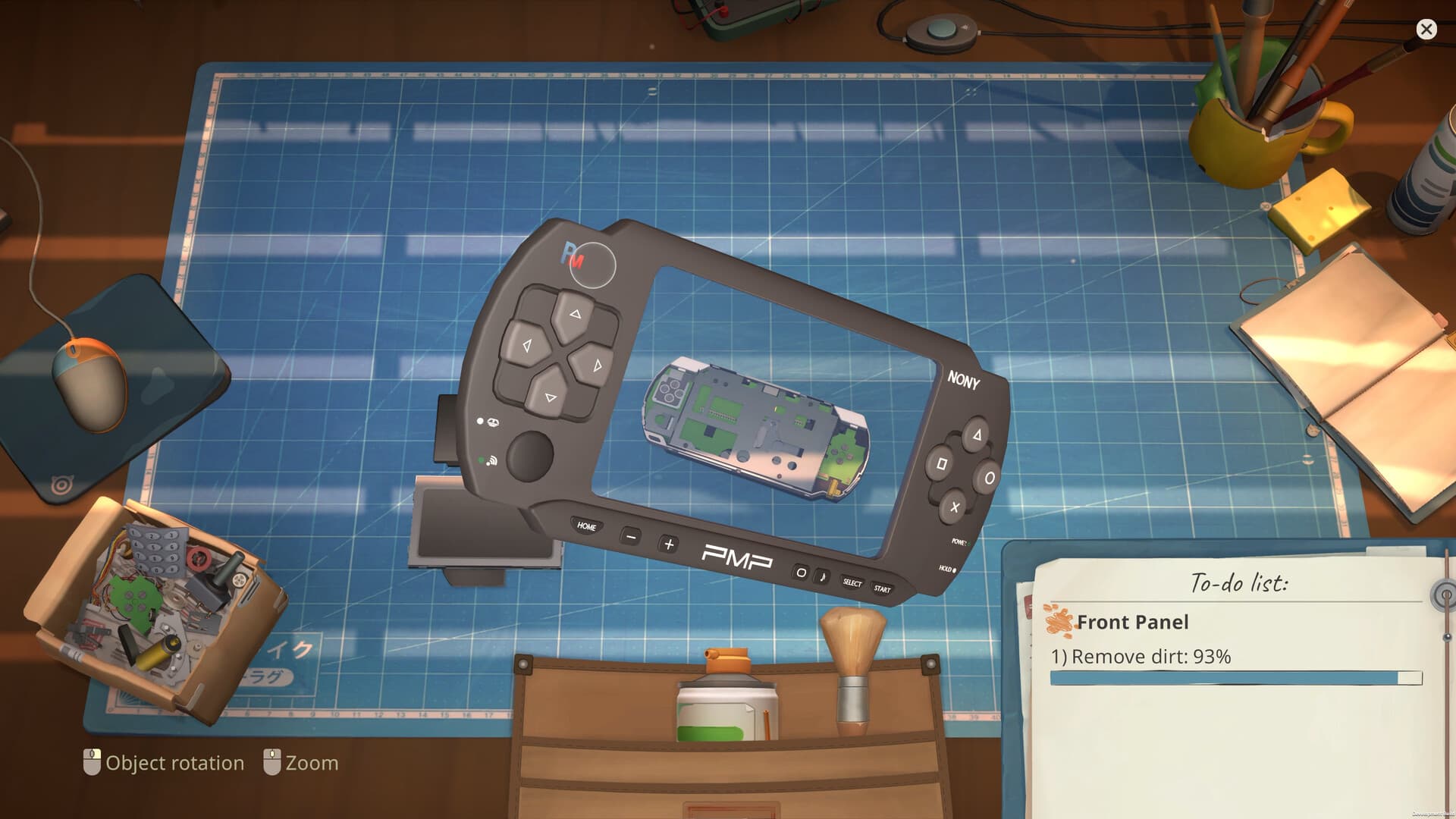 Portable console being cleaned on the ReStory workbench