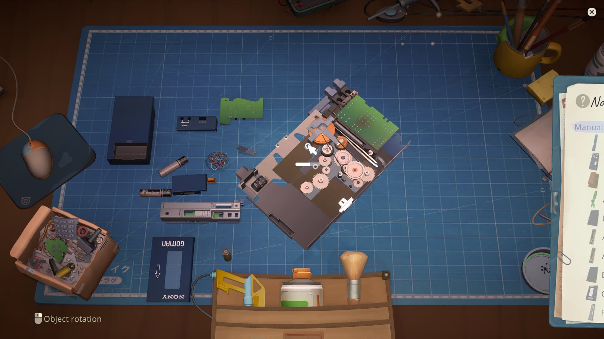 Disassembled device on the ReStory repair workbench